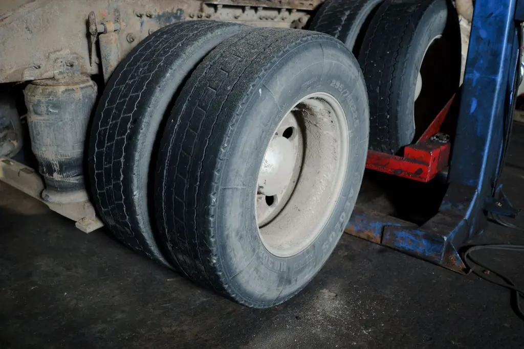 Dual rear tires on a raised heavy-duty vehicle